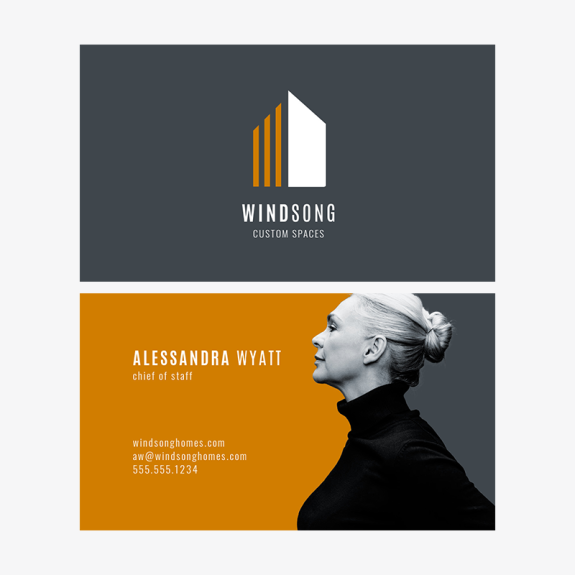 Front/back business card design with logo on one side, and image and contact information on other. Dark gray, orange, and white color scheme.